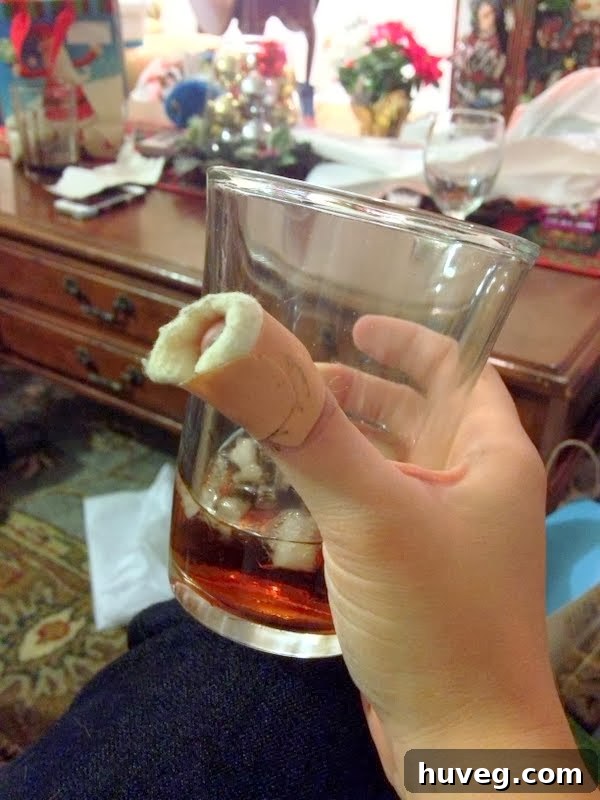 Injured finger from a wine opener mishap during the holidays, bandaged for protection