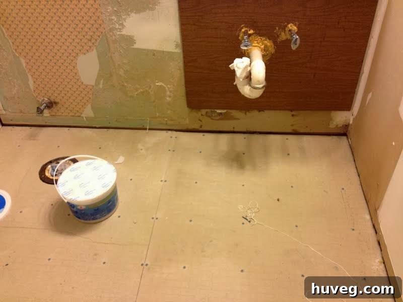 Bathroom visibly drier after 12 hours of active drying efforts following a plumbing leak.