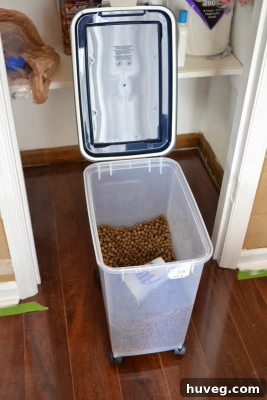 Close-up of the dog food bin with a flip-top lid