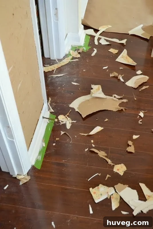 Removing trim and exposing wallpaper on a kitchen wall
