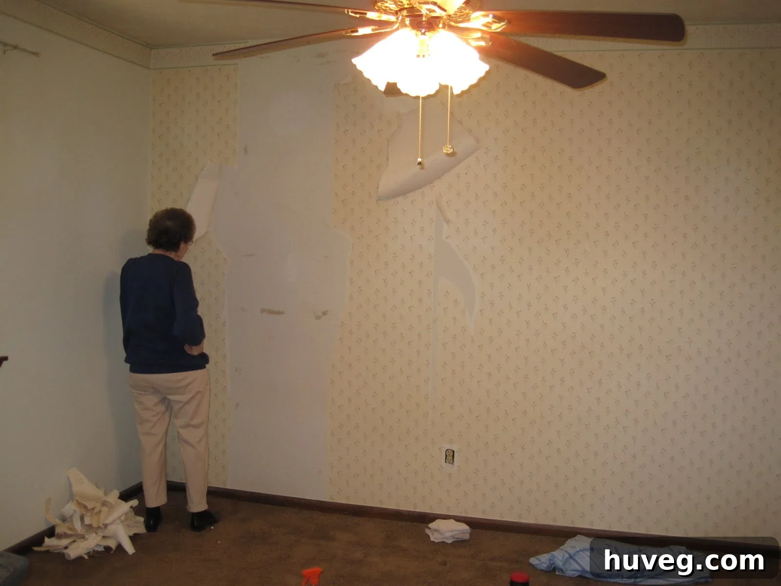 Granny peeling wallpaper in the guest bedroom, early stages of renovation