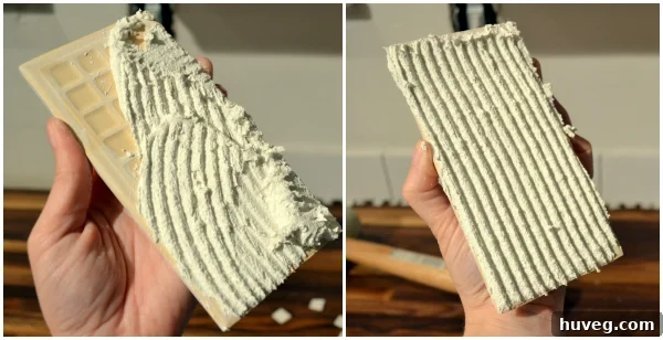 Applying thinset to the back of a tile, known as back-buttering