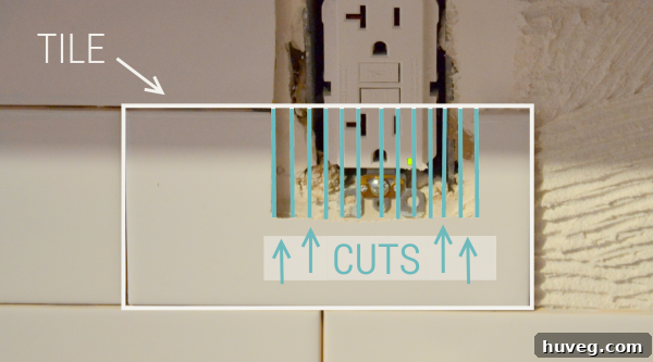 Cutting tiles precisely to fit around electrical outlets