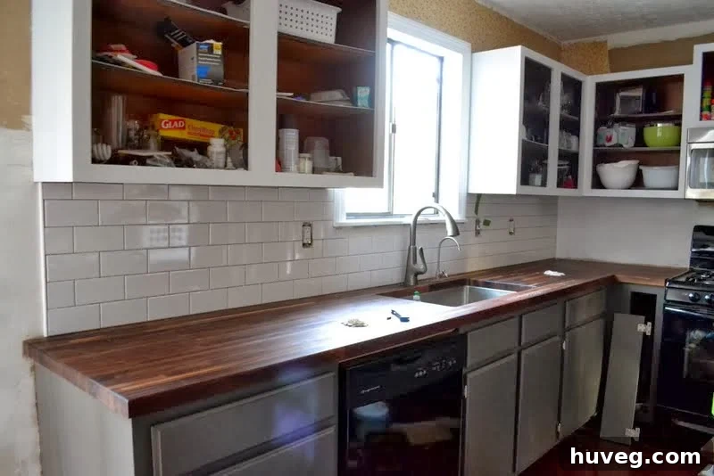 Finished kitchen remodel featuring a new subway tile backsplash