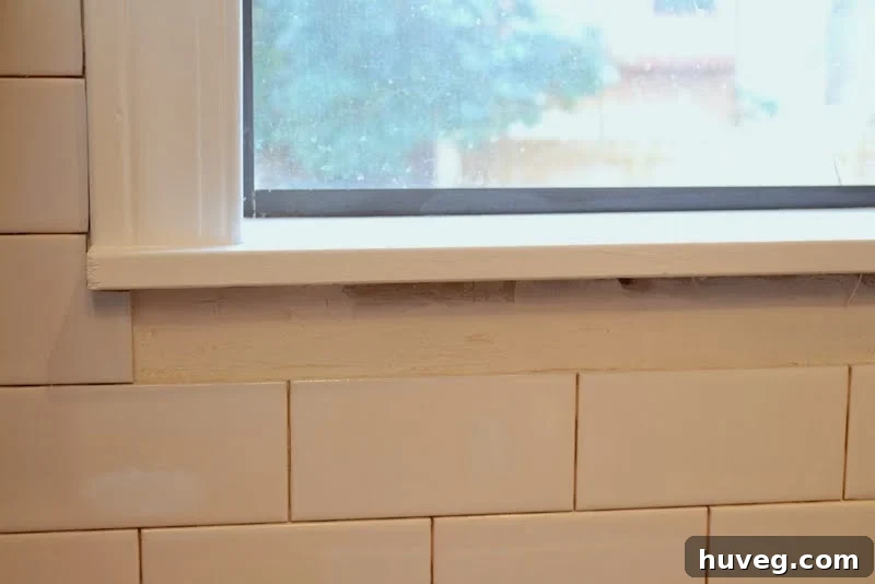 Leaving a precise space for window molding reattachment during backsplash tiling