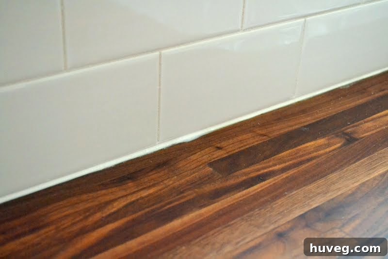 before using a putty knife to clean excess caulk