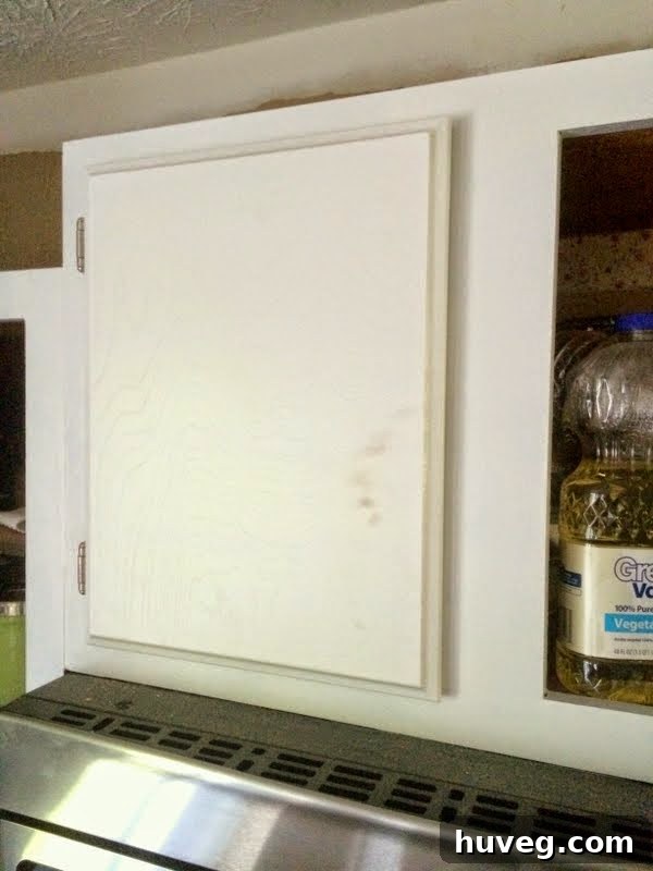 Another dirty cabinet door close-up