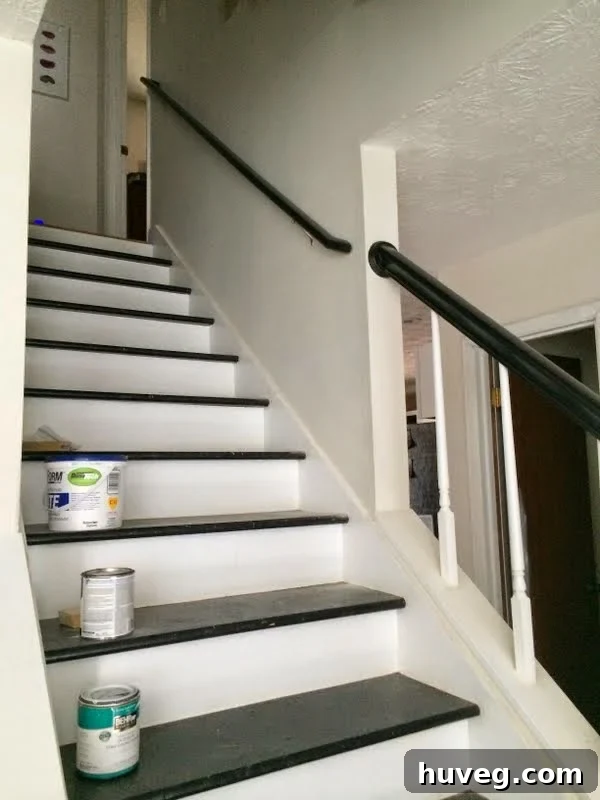 Another perspective of the newly installed stair handrail, highlighting its clean lines and secure fit