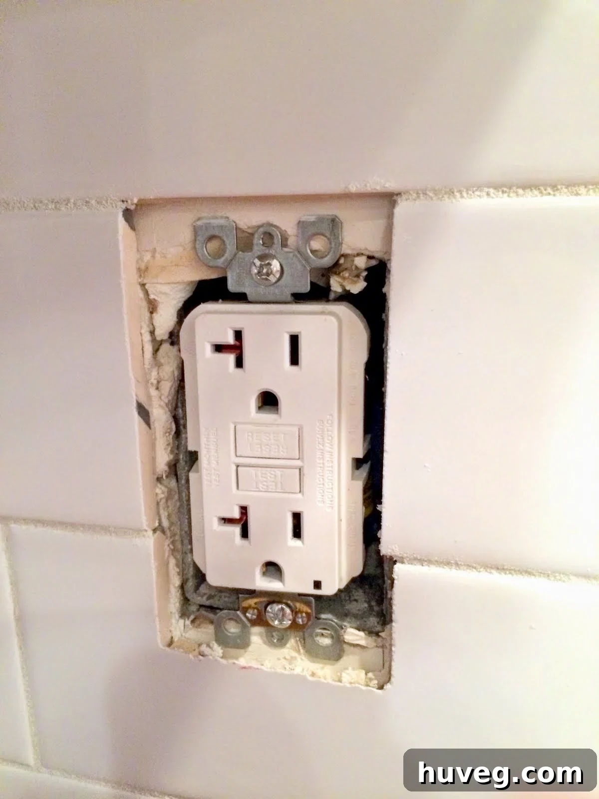 outlet not sitting flush with new tile