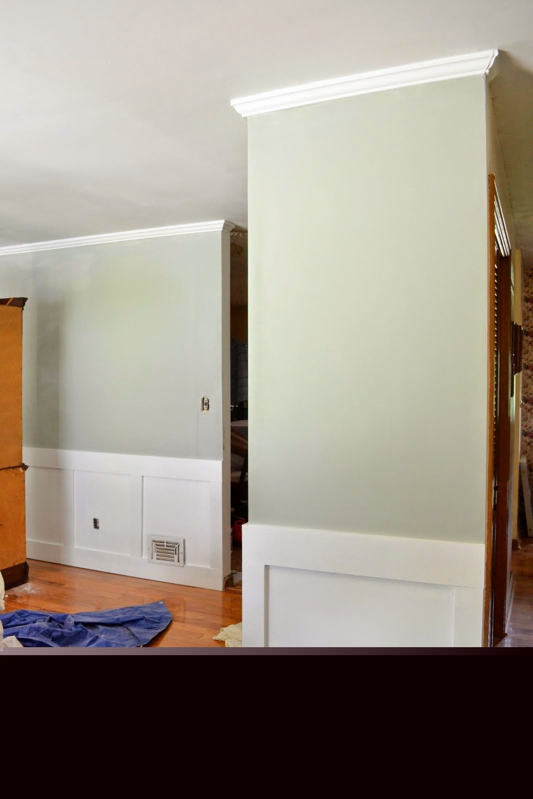 Dining room in progress, showcasing the clean, newly painted walls before final decor