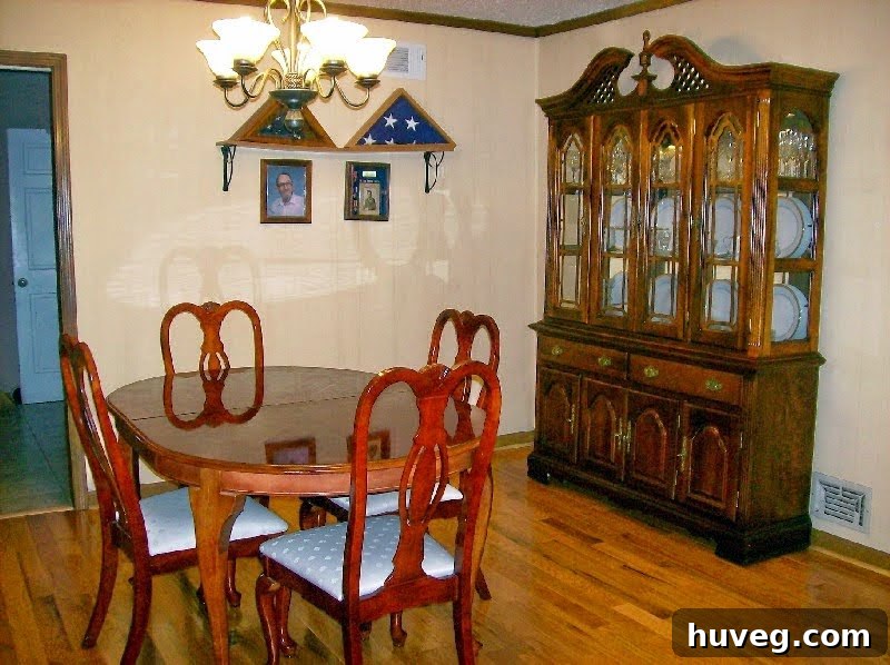 Dining room showing yellow-painted wood paneling before drywall installation