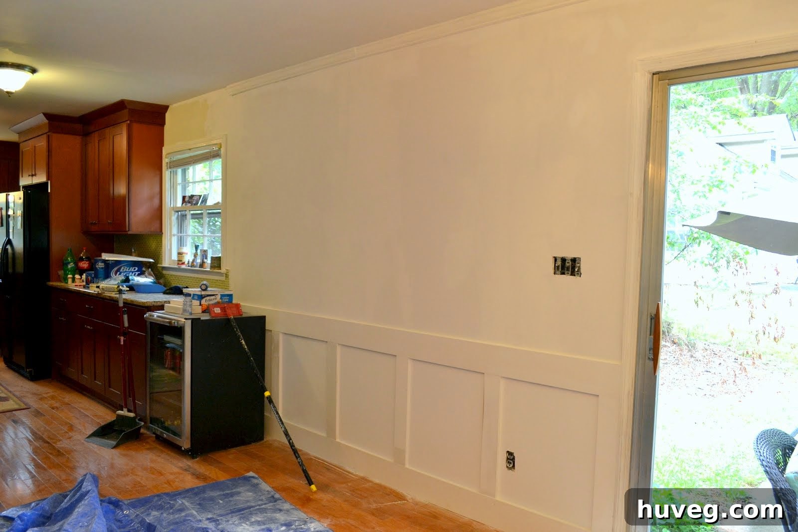 Dining room walls and ceiling pre-paint, showing the extensive drywall and mudding work completed