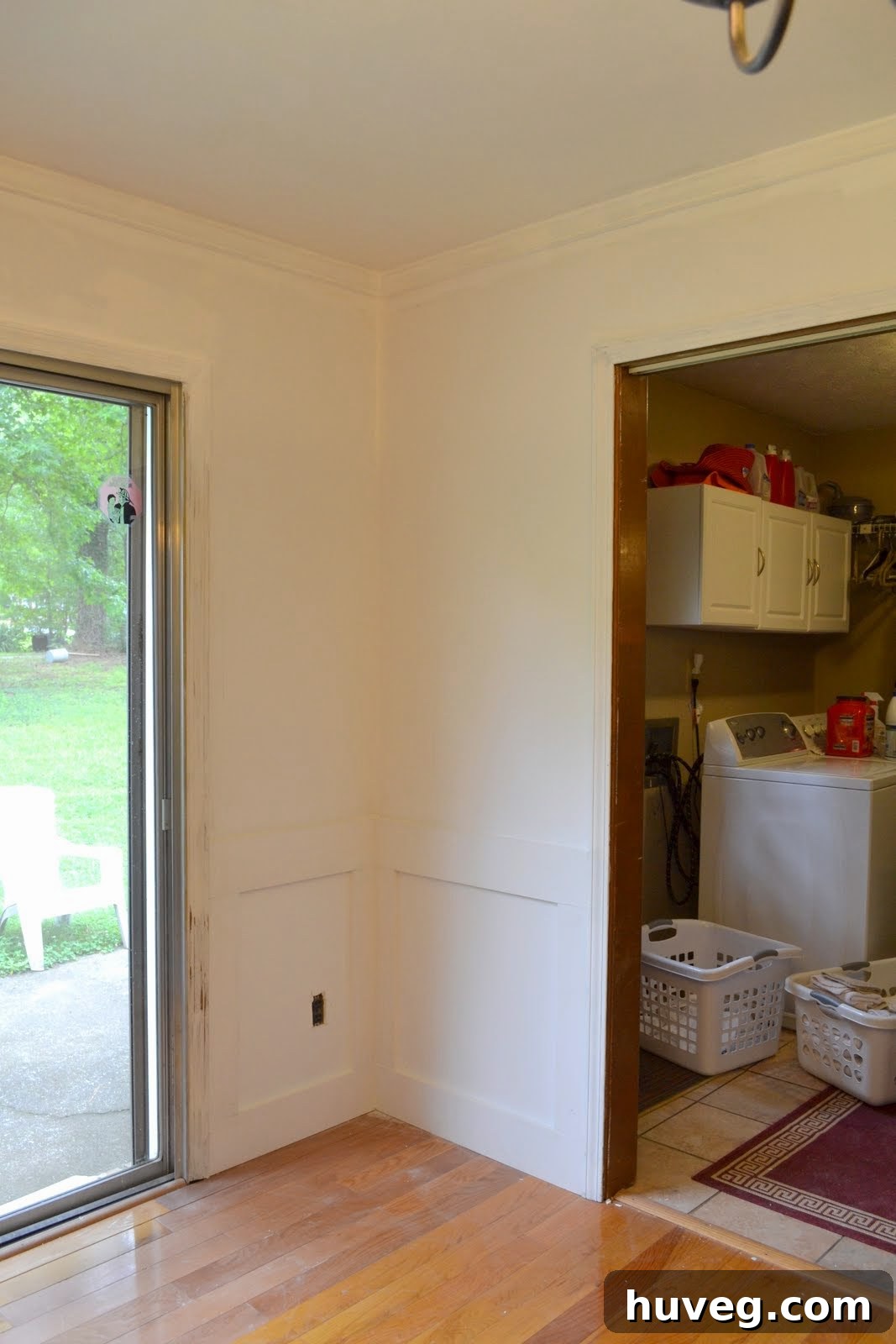 Before shot of the dining room interior, showing bare drywall and the scope of the renovation