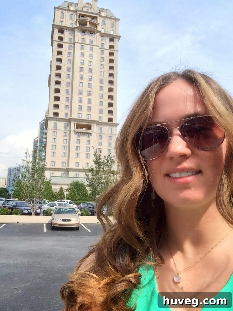 Sarah standing confidently outside the Haven Conference hotel, reflecting on a successful event.
