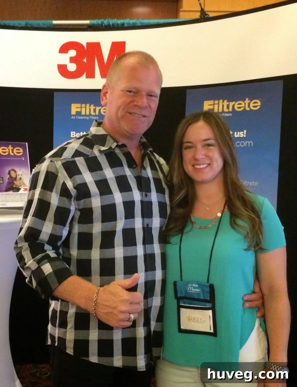 Sarah smiling alongside Mike Holmes at the Haven Conference, a charming interaction with a celebrity guest.