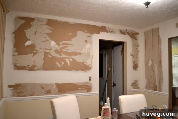 Damaged wall after wallpaper removal
