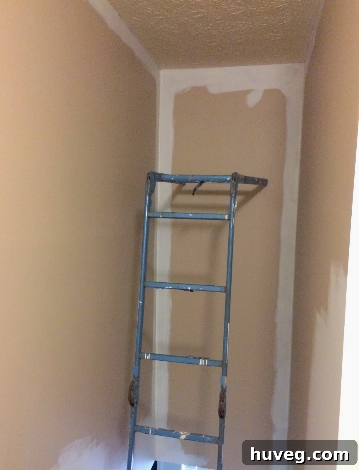 Before image of the hallway in a dark tan color