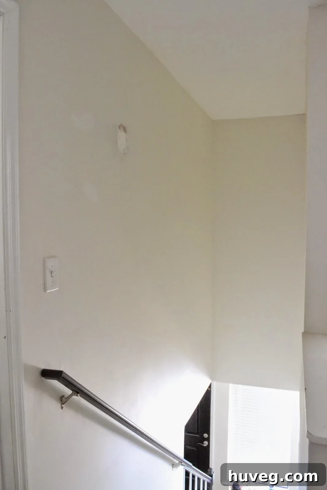 After image of the newly painted bright hallway
