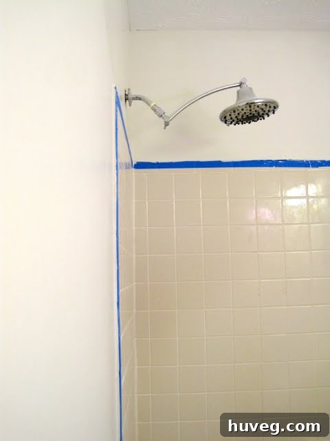 Skim coating project in a bathroom, showing smooth walls after application.