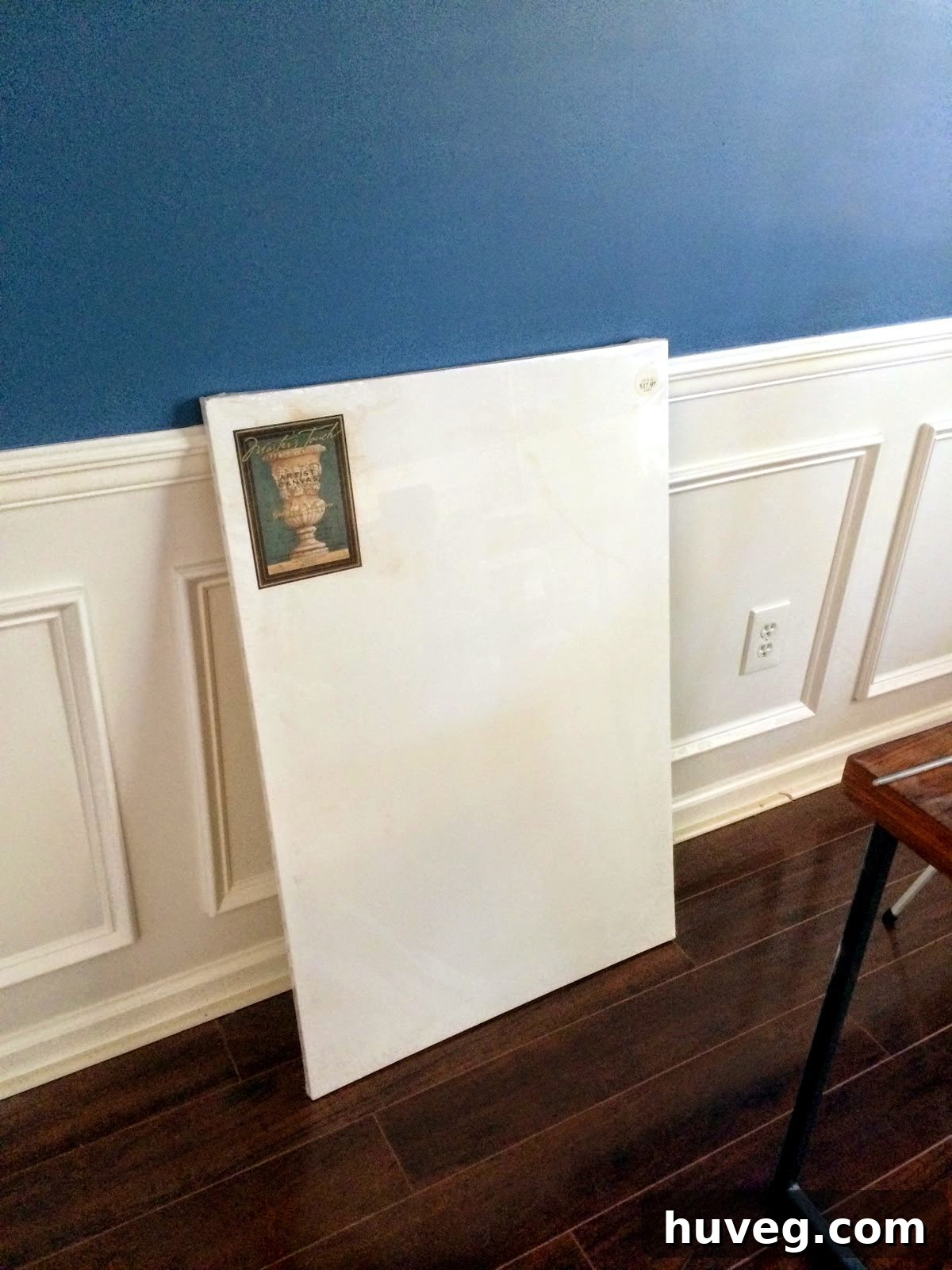 Two unpainted canvases, retrieved for a DIY art project to decorate the dining room wall.