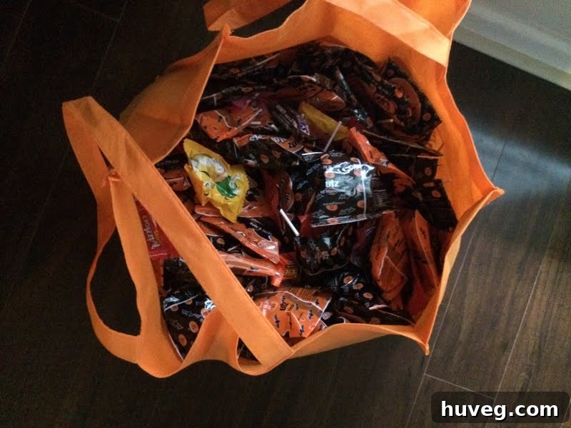 Large tote bag overflowing with Halloween candy