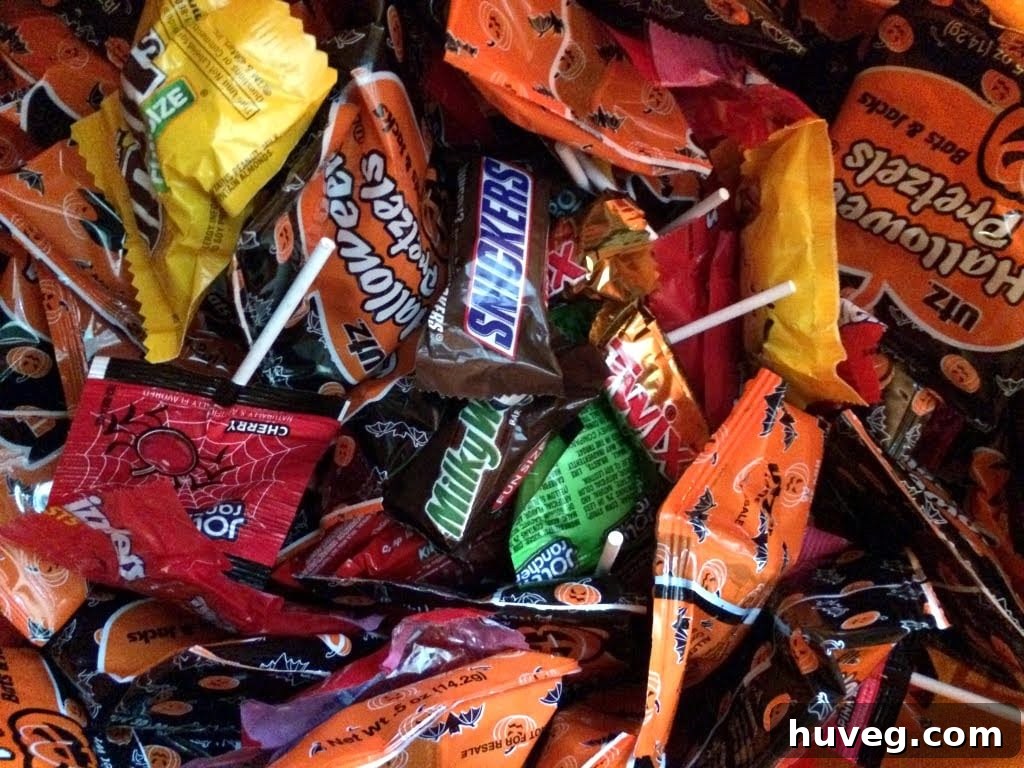 Child telling a joke to receive Halloween candy from a large tote