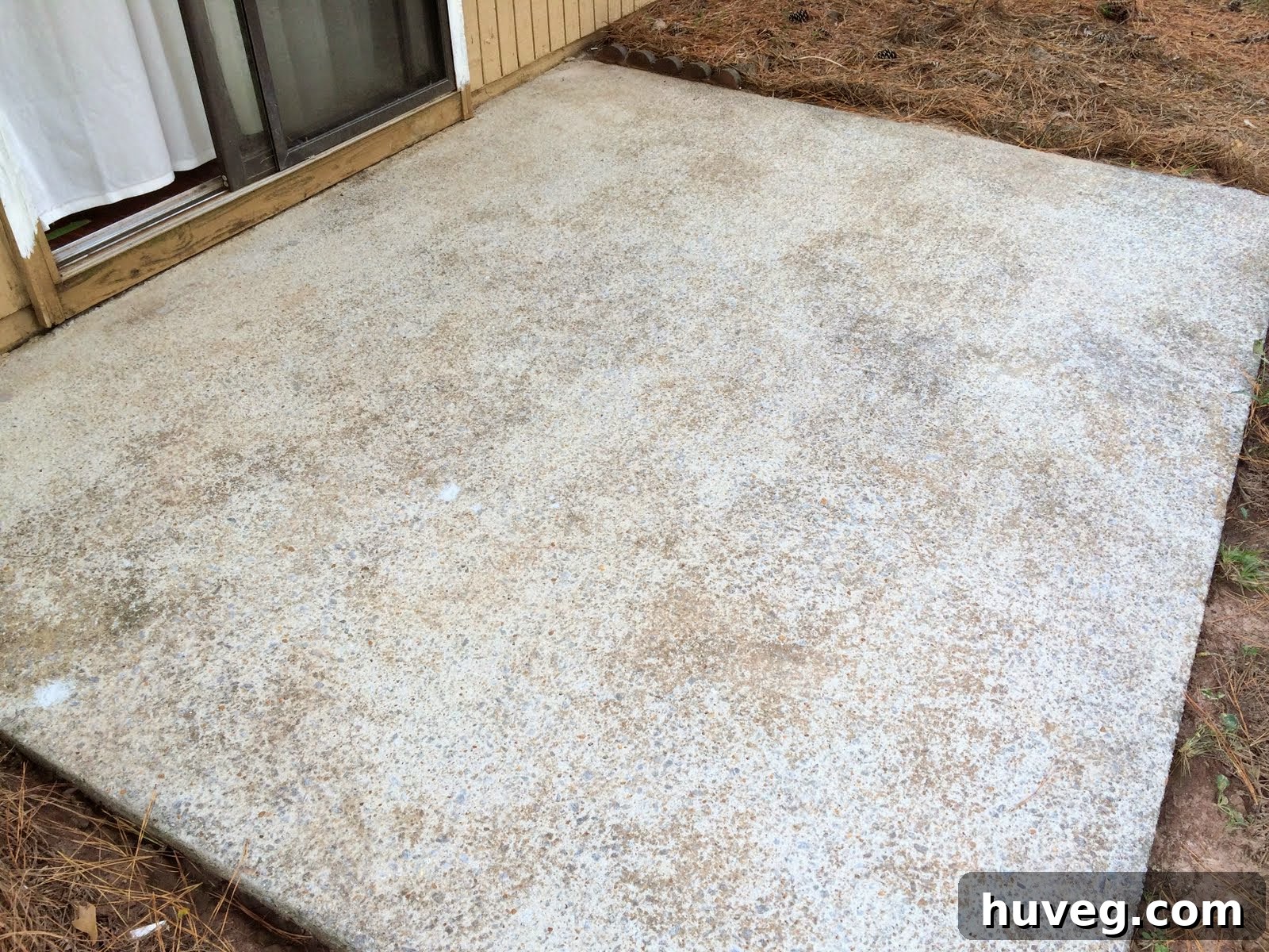 Dry concrete patio slab after thorough pressure washing and cleaning