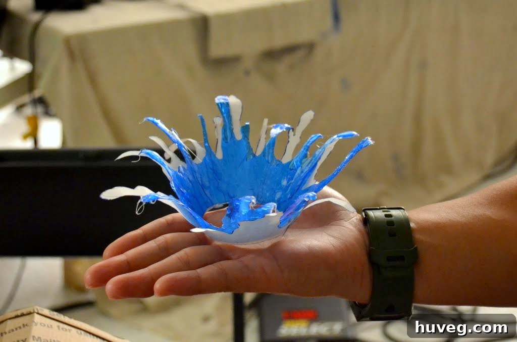 Hand holding a splashing water prop