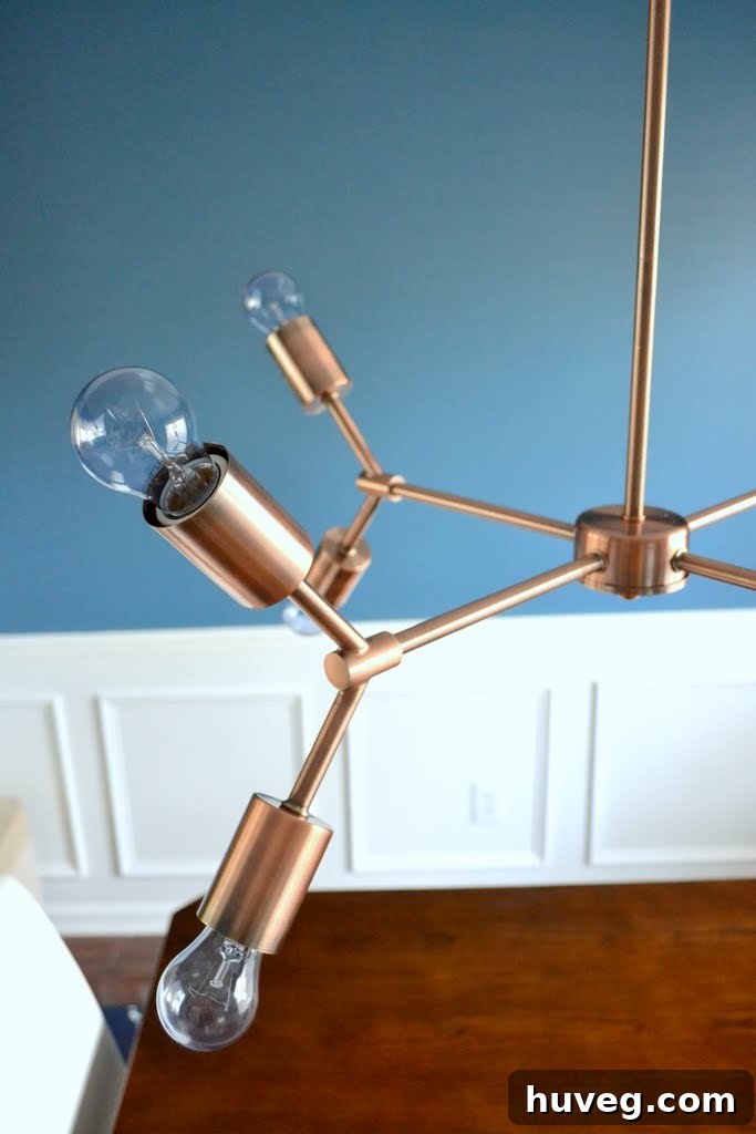 Architectural view of the modern copper chandelier, emphasizing its sculptural form and elegant proportions
