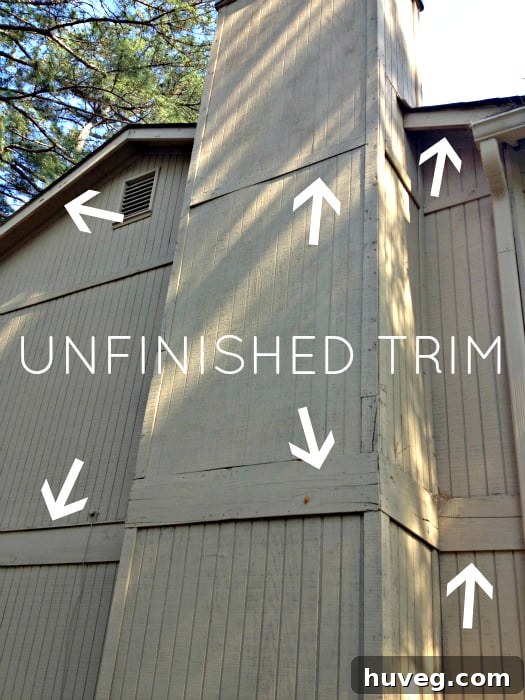 Unfinished trim work on a house exterior, highlighting areas needing further attention.