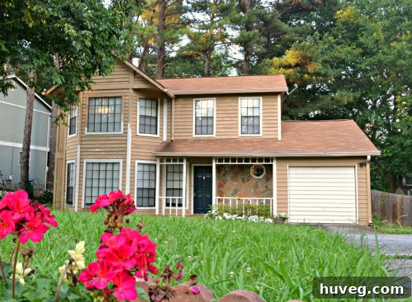 Front view of the newly updated house exterior, showcasing improved curb appeal.