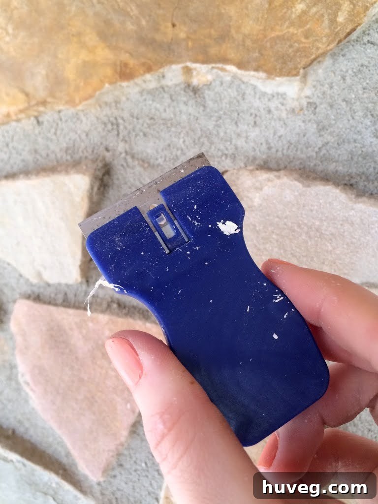 Close up of a mini glass scraper