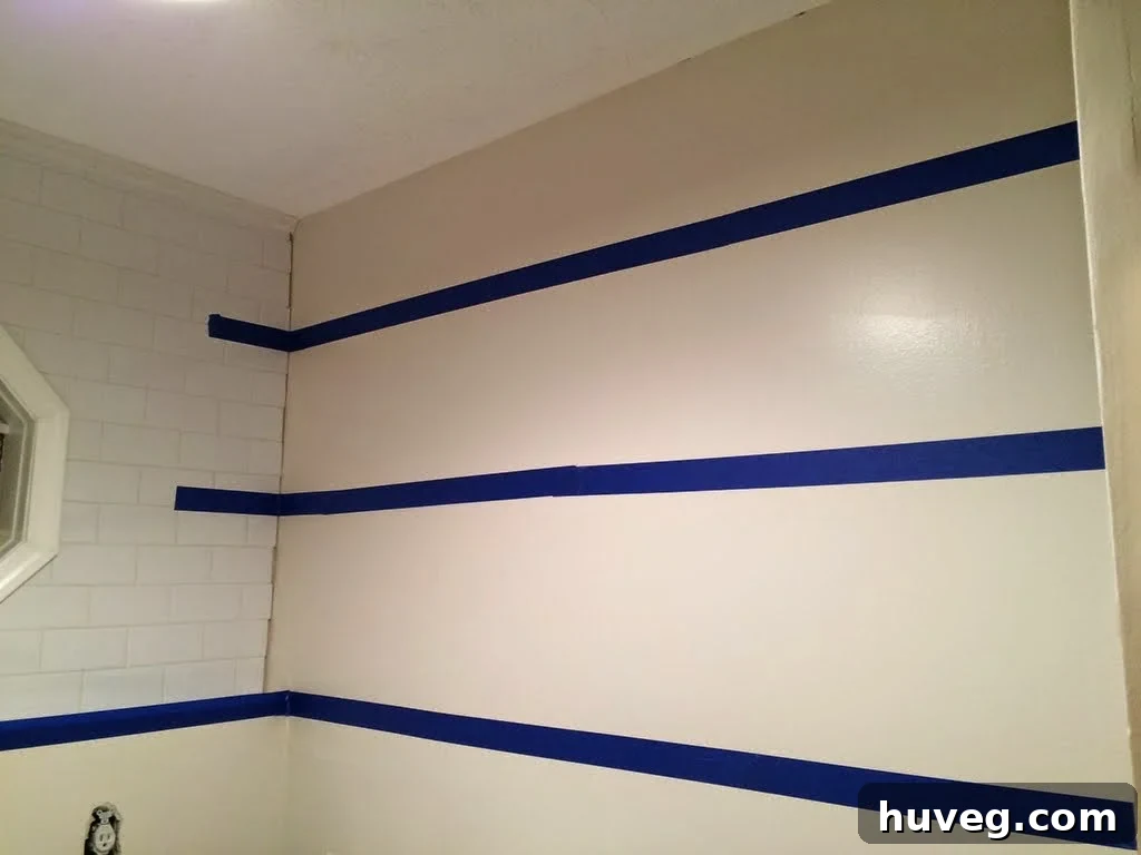 Blue tape demonstrating cleat system for laundry room shelves