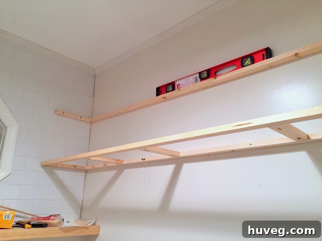 Laundry room shelves in progress, showing supports