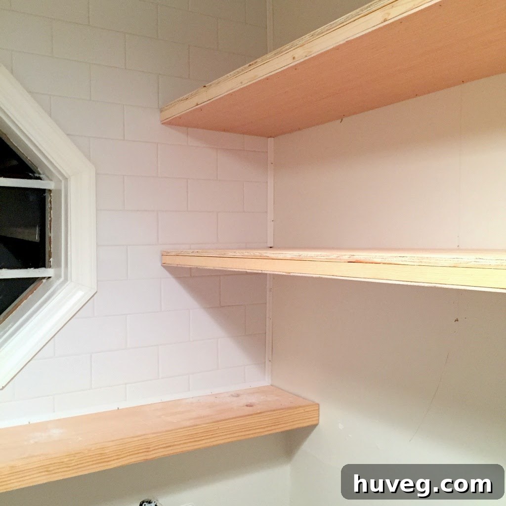Floating shelves supports installed in laundry room