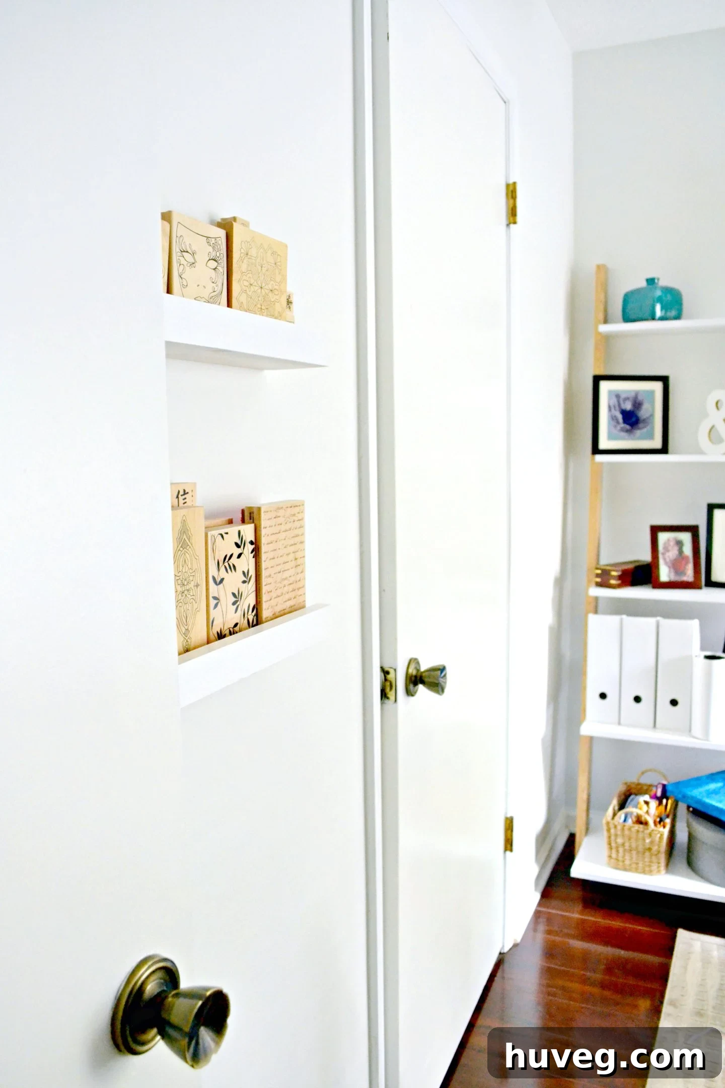 Close-up of a DIY storage ledge filled with an organized wood stamp collection.