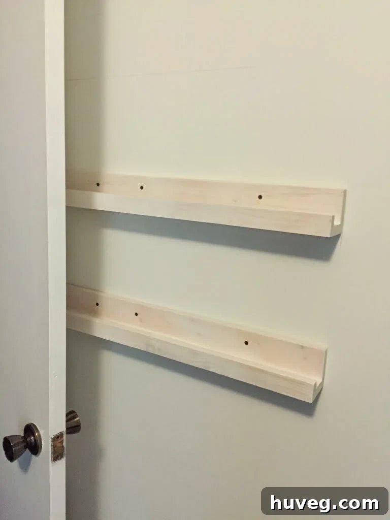 Pre-primed DIY storage ledges ready for installation against a wall, highlighting the smooth finish.