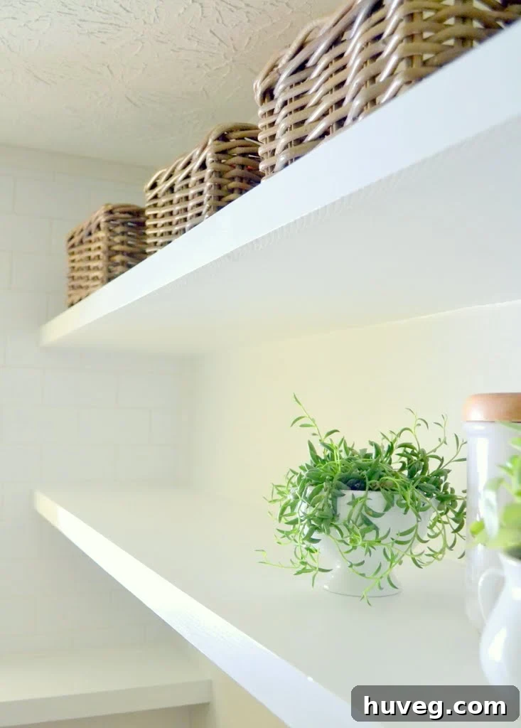 Decorated DIY thin floating shelves in laundry room