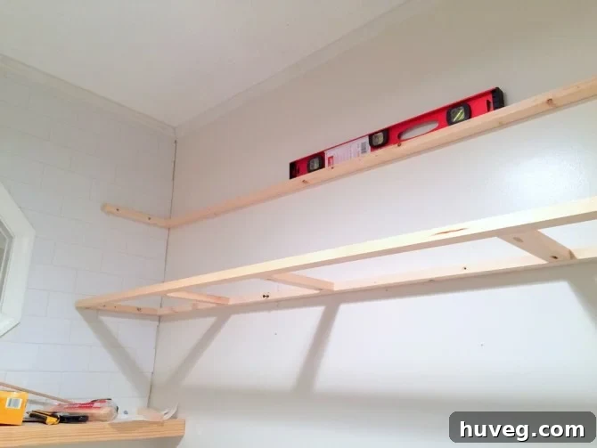Laundry room with floating shelf frame installed