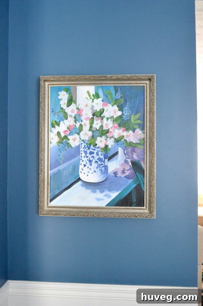A vibrant floral painting, professionally framed, a cherished family heirloom destined for a new home.