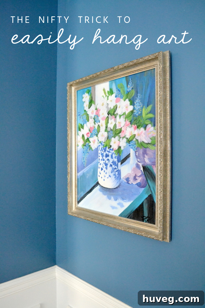 Cool idea! The nifty trick to hanging art with ease: it doesn't take much to hang art with these simple hangers. #art #diydecorating #designtips