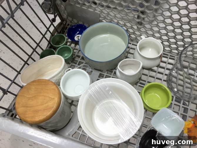 A collection of assorted ceramic pots purchased from Goodwill, awaiting their upcycling transformation.