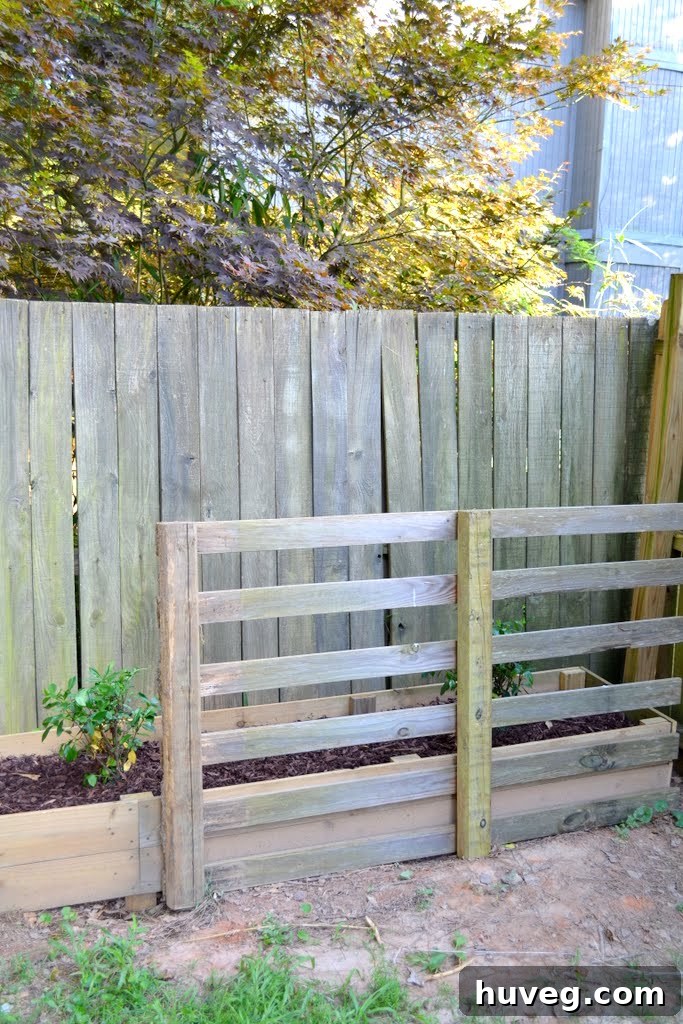 Temporary Pallet Barrier for Dog in Garden Bed