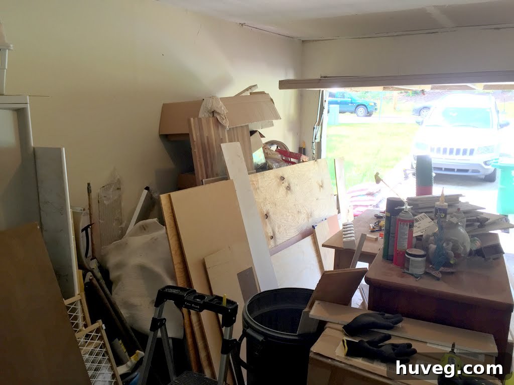 Before photo of a very messy and cluttered garage