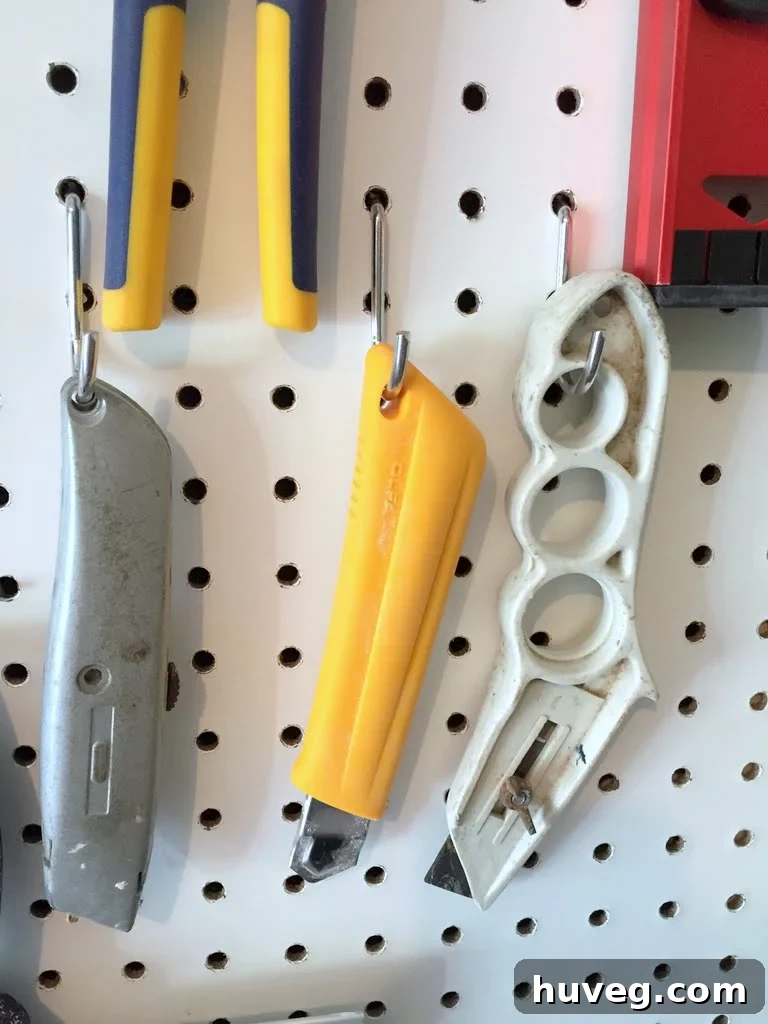 Before: Loose pegboard hooks causing tools to fall