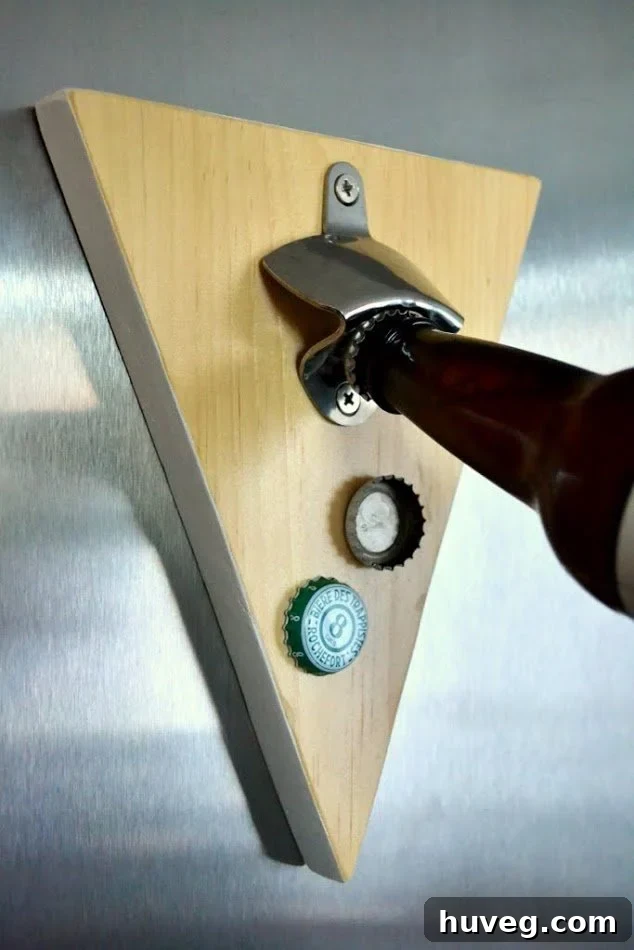 Magnetic beer bottle opener crafted from scrap wood, featuring a unique shape and ready for use.