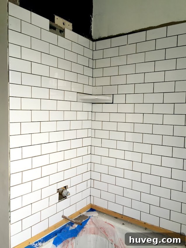 Newly tiled bathroom shower walls at Black Feather Farm