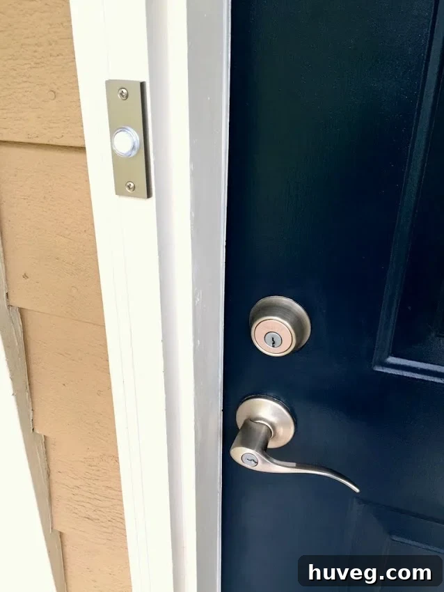 The new matching doorbell complements my navy blue front door with nickel finish accessories.