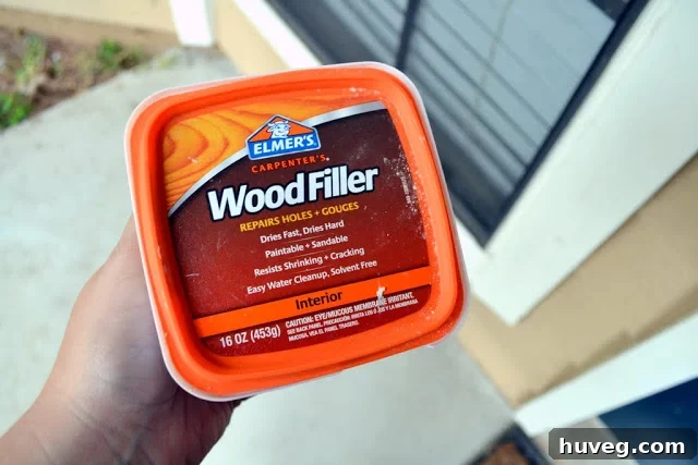 I patched the holes from the old doorbell's poor alignment with Elmer's Wood Filler
