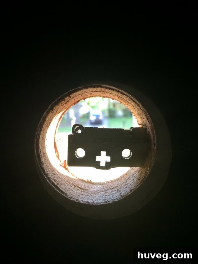Old front door hardware before replacement, indicating wear and tear.